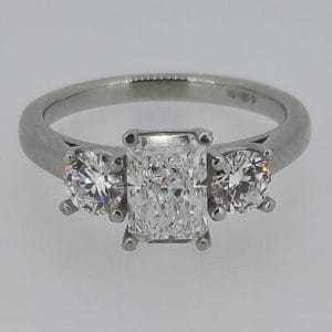 3 stone certificated lab grown emerald cut diamond with round outer cut diamonds set in a platinum ring (2)